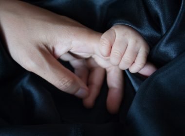 single parenting options - pic - baby holding parents finger